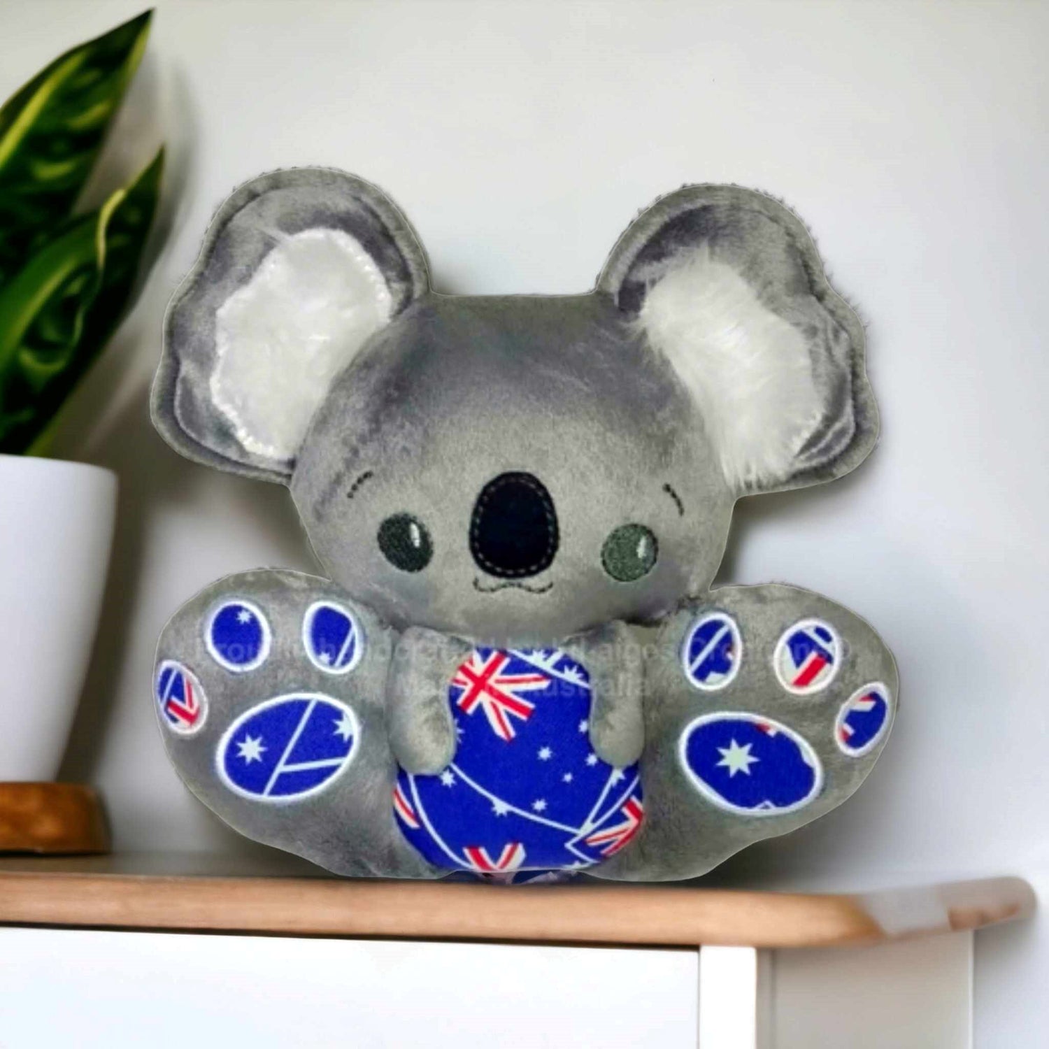 Cute made in Australia koala plush toy with Australian Flag applique on tummy and feet pads. 