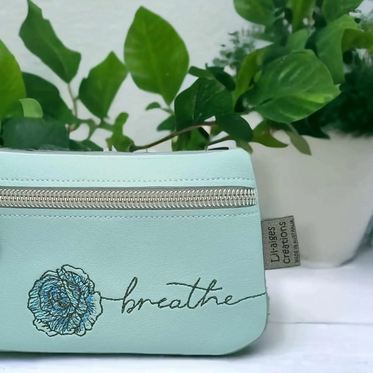 Breathe in Style: Light Blue Zipper Coin Purse with Rose Design - Image #3
