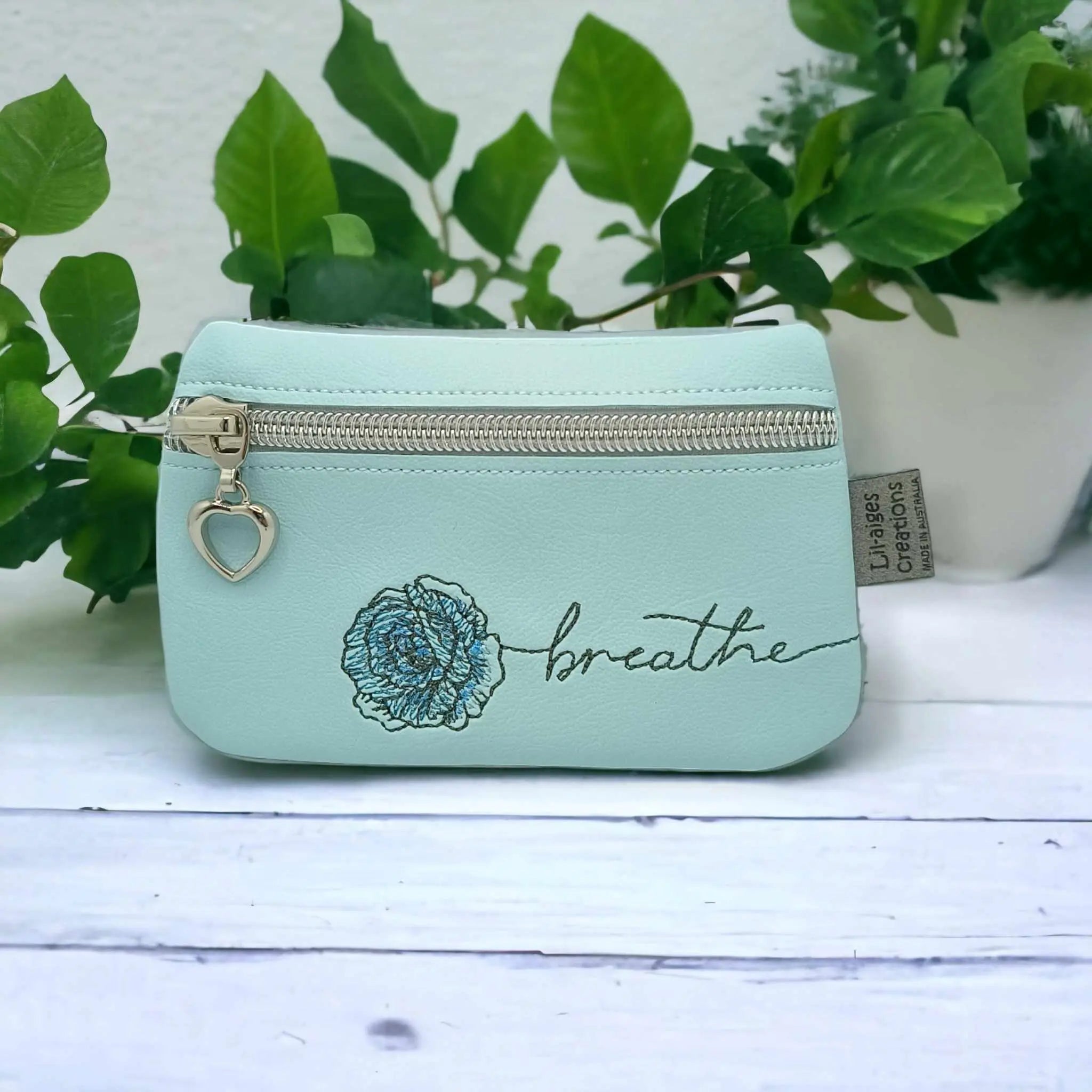 Copy of Fearless in Style: Light Blue Zipper Coin Purse with Lily Design - Image #1