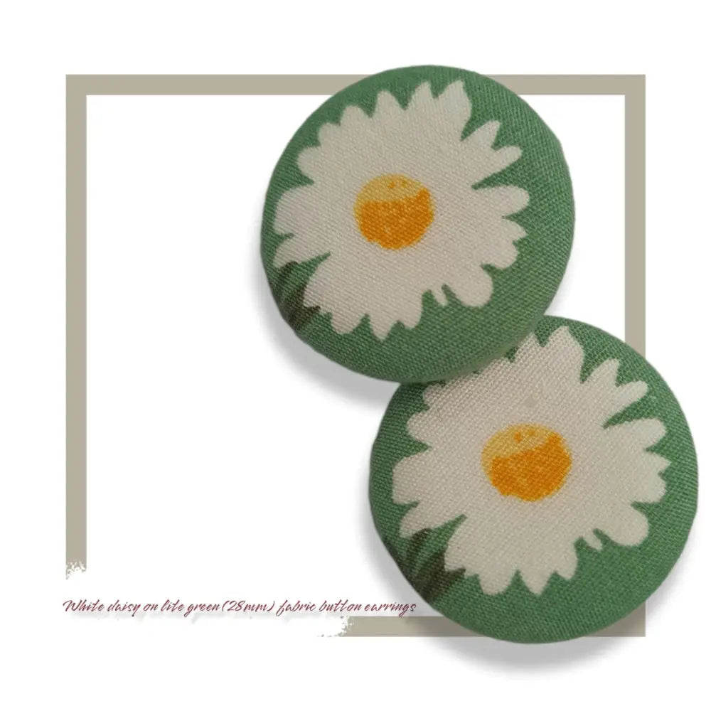 White summer daisy on light green themed fabric button earrings